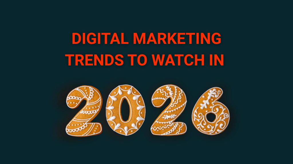 A dark blue-green background with the words "Digital marketing trends to watch in 2026." The 2026 is made of festively decorated cookies.